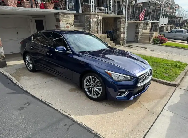 Blue Infiniti with a glossy paint finish